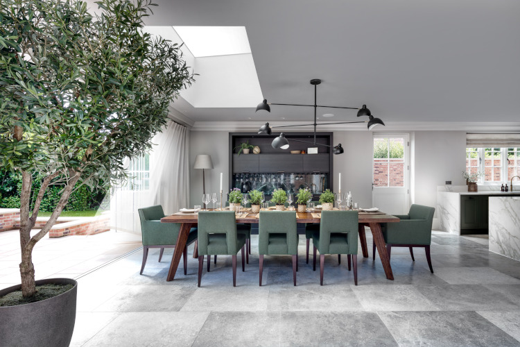Example of biophilic design - Our Port House Scheme blurs the boundaries between the outdoors and indoors by incorporating a flush threshold, similar flooring materials, structural planting and a large exterior opening.