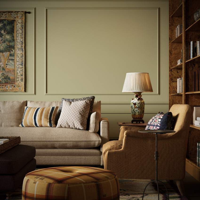 A side view of the children's lounge showing large, comfy sofas and armchairs against sand coloured wall panelling and wall hangings as part of the Queen Anne Interior Design Project.