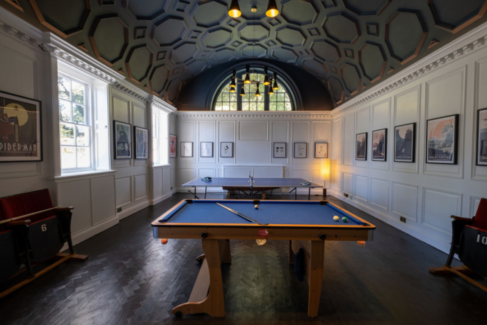 Luxurious games room wuth a vaulted ceiling, billiards table, table tennis table at Fowey Hall in Cornwall.